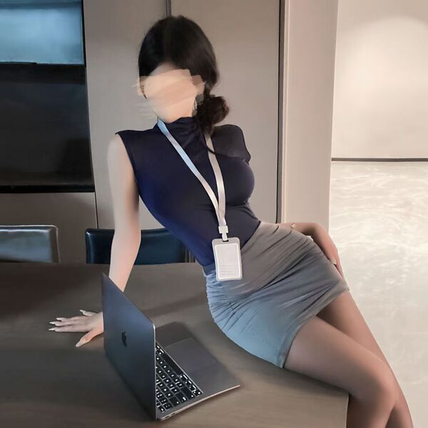 Woman in sleek navy sleeveless sheath dress with lanyard, posing at desk with laptop—sexy office secretary costume set for wo...