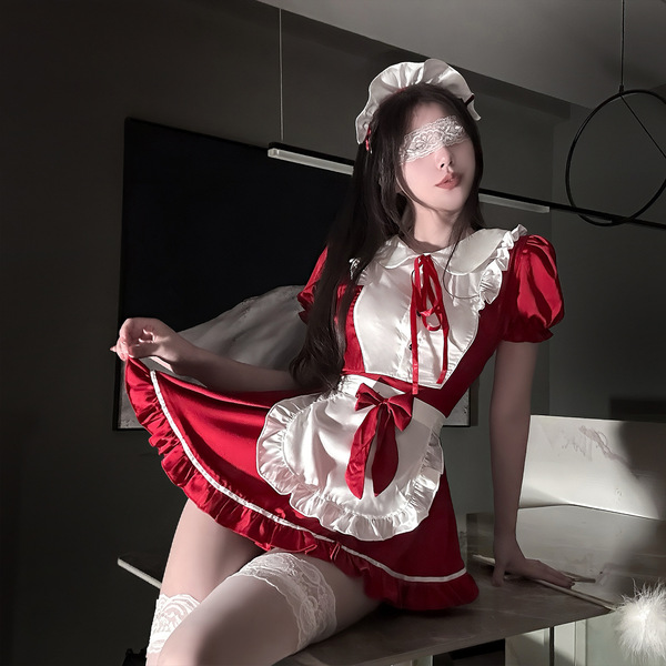 A woman poses in a red and white maid outfit with lace details, featuring a butterfly-themed design. the ensemble includes st...