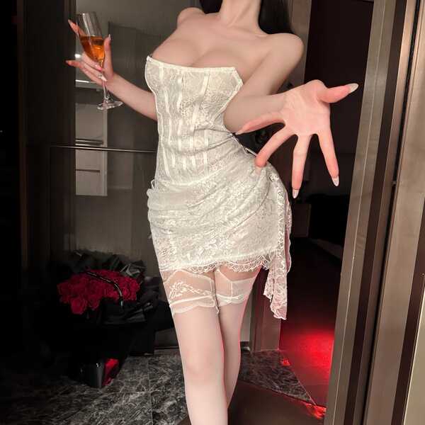 Woman wearing feiniao moon gaze lace bodysuit, holding wine glass, posing in elegant white mesh camisole dress with lace trim...