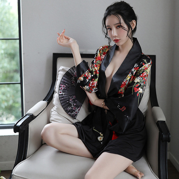 A woman poses elegantly in a japanese kimono-style lingerie set, featuring a deep v neckline and floral patterns. the no-remo...