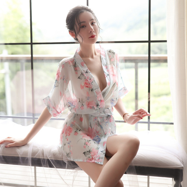 A woman poses elegantly in a japanese-style sleepwear set featuring sheer chiffon lace, with floral patterns on the robe and ...
