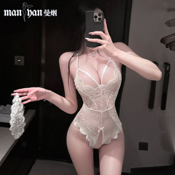Woman in white lace bodysuit with open crotch and straps, holding matching garter, showcasing seductive lingerie design.