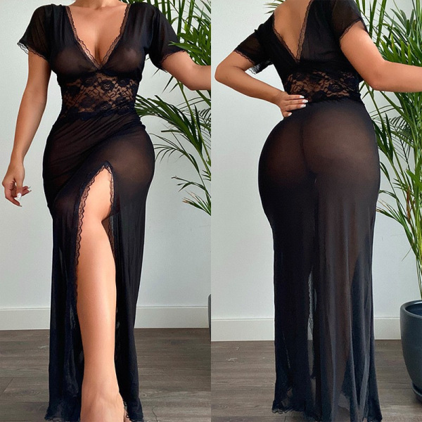 Woman wearing a sexy black lace mesh slit long dress, showcasing its sheer fabric and elegant design for nightclub or lingeri...