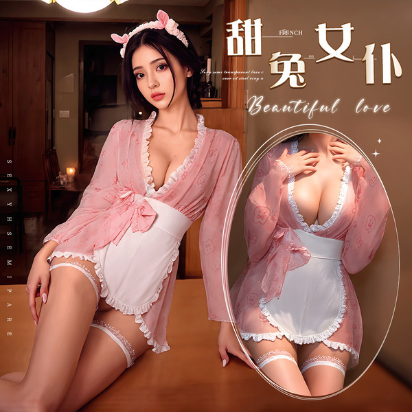A woman wearing a pink bunny-themed japanese-inspired lingerie set, featuring a bow and kimono robe design, perfect for sleep...