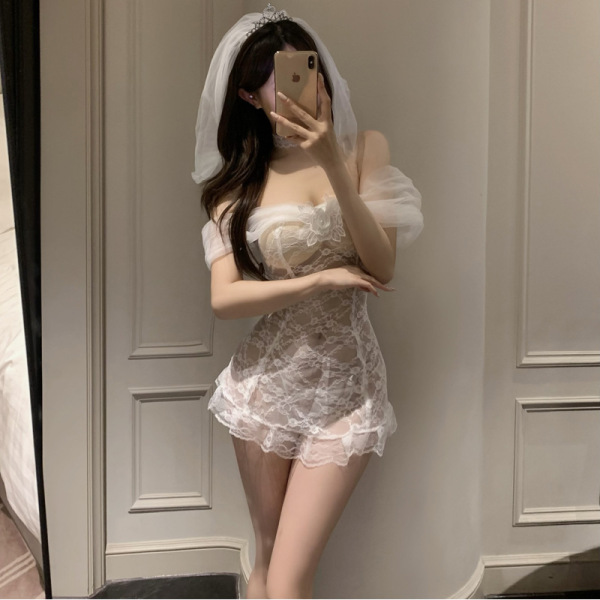 Woman in mirror wearing pure & playful lingerie set - sexy sheer bridal sleepwear with veil, romantic nightwear style.