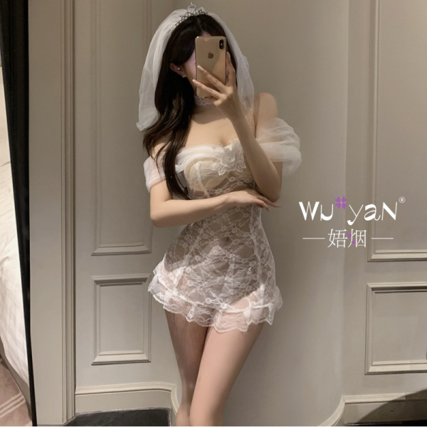 Woman in mirror wearing white lace bridal lingerie set with veil, modest yet sexy design for sleepwear or cosplay.