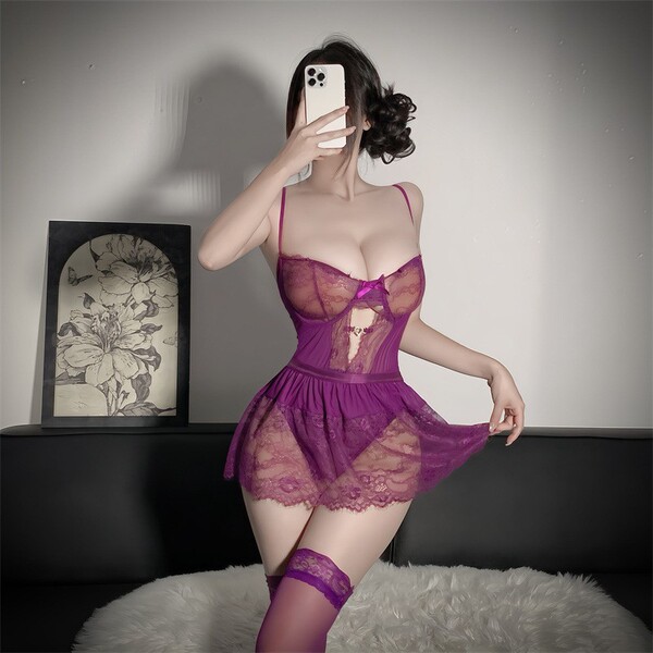 Woman modeling purple plus size lace bodysuit with underwire and open-crotch design, paired with matching thigh-highs.