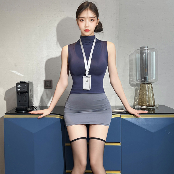 Woman wearing pxfs secretarial bodysuit skirt, air hostess style lingerie with sheer top and gray mini skirt.