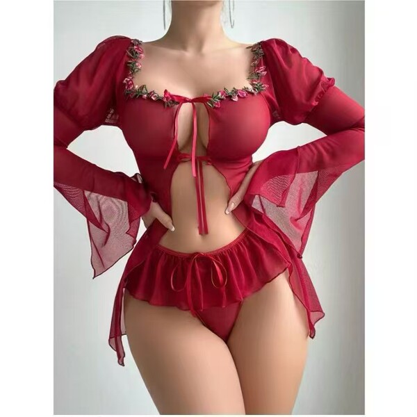 Woman modeling a red sexy lingerie set with floral embroidery, sheer bell sleeves, and a skirted bikini bottom.