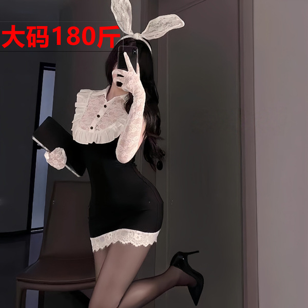 Woman in black bodycon dress with white lace collar, bunny ears, and gloves posing for mirror selfie.