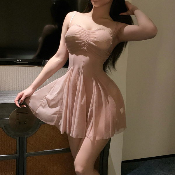 Woman wearing a seductive lace mesh slip dress set, featuring a busty plus size provocative lingerie outfit with a flared ski...
