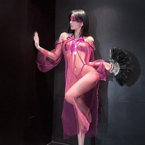 Woman in pink sheer mesh lingerie set with lace, high-end stockings, feather fan & blindfold — sensual, playful elegance.