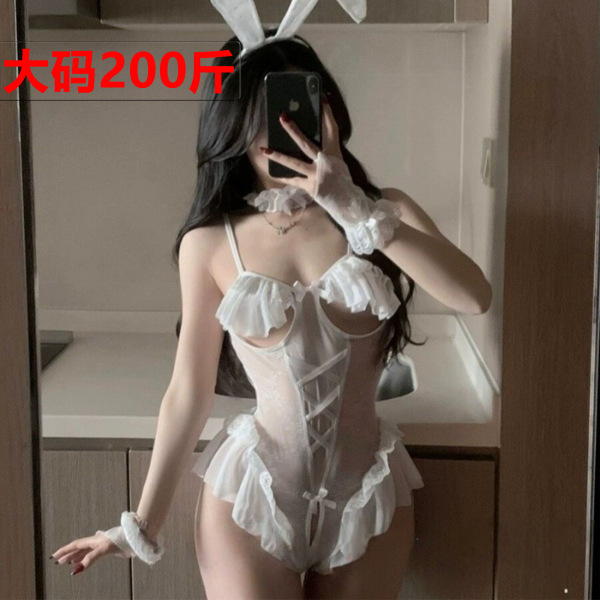 Woman modeling white sheer mesh bunny lingerie set with open-crotch, cut-out bust & ruffles.