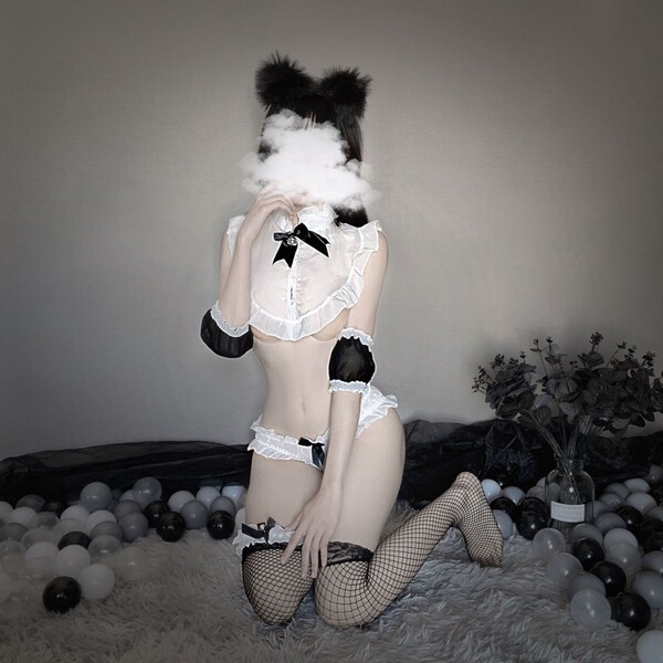 Sexy maid costume lingerie set featuring black and white ruffled top with fishnet stockings, perfect for seductive role play ...
