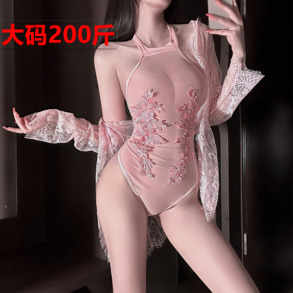Woman wearing a pink sheer lace bodysuit with floral embroidery and a matching open robe.