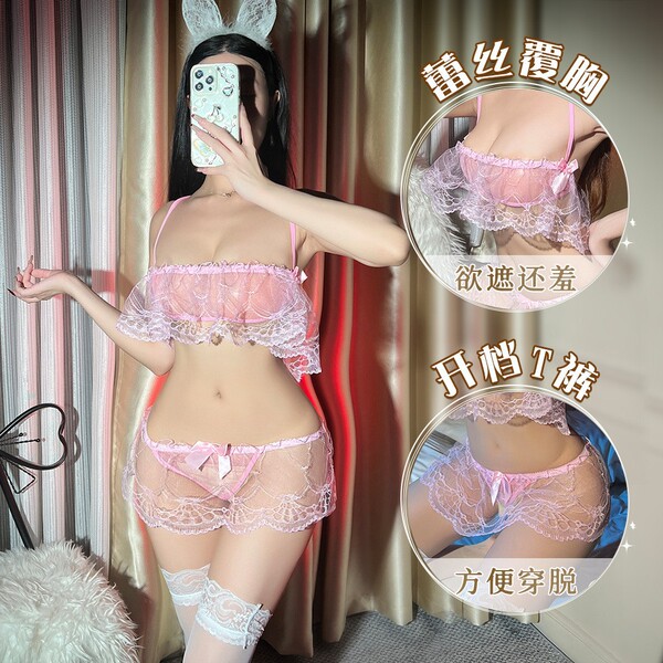 Woman modeling pink lace babydoll set with sheer mesh, open-crotch design, and matching garter stockings for intimate nights.