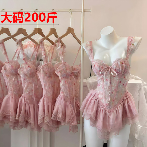 Pink floral lace bra set with push-up padded cups and waist-cinching corset design, displayed on mannequin and hangers.