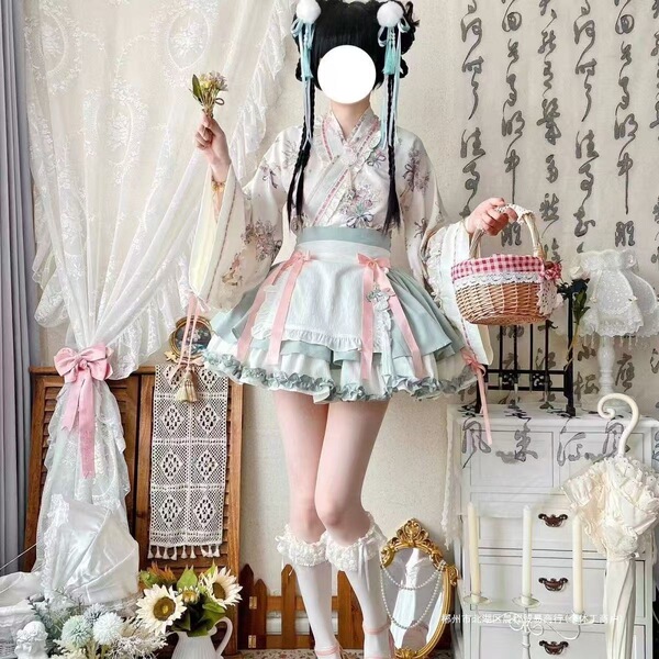A woman models a sweet lolita maid dress set featuring a floral-patterned kimono, ruffled skirt, and apron, perfect for cospl...