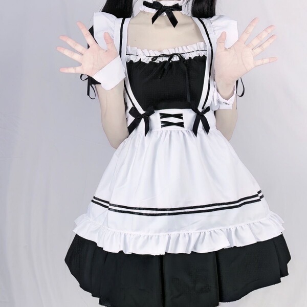 A plus-size maid cosplay dress featuring black and white colors, ruffled details, and a bow design, perfect for lolita style ...