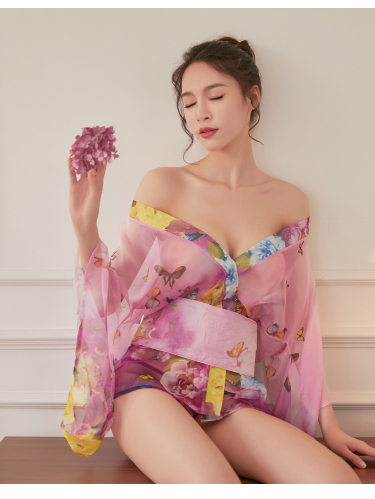 A woman wears a sheer chiffon japanese kimono lingerie set featuring butterfly prints, creating an elegant and sexy bathrobe ...