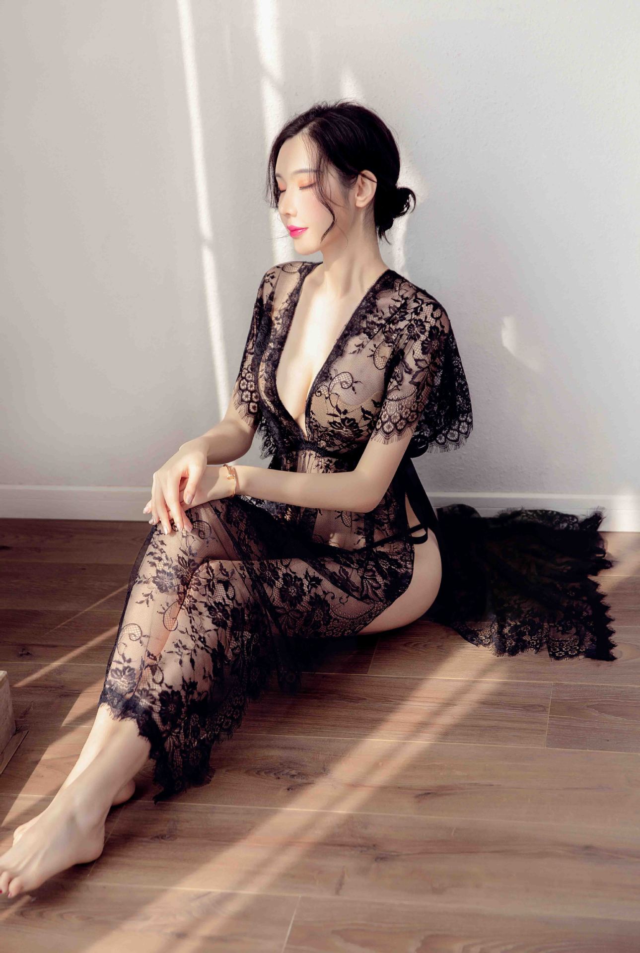 Elegant black lace sleep dress featuring sheer mesh and high slit, perfect for women seeking sexy yet sophisticated lingerie.