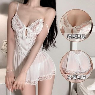 Woman wearing a white lace sheer sleep dress with delicate straps and floral details, showcasing its sweet and alluring desig...