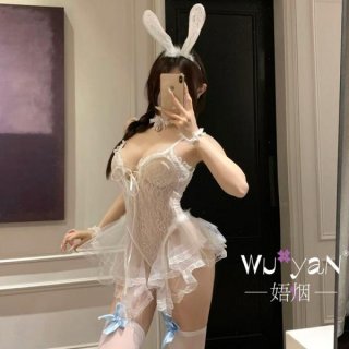 Woman in white lace bunny lingerie set with ears, garters, and playful jk-style details for seductive sleepwear or roleplay.