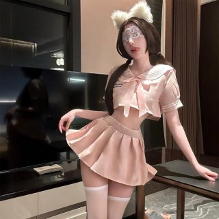 A woman poses wearing a qingshe jk lingerie set featuring a pink pleated skirt, sailor-style top with bow, and cat ears headb...