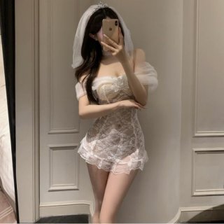 Woman in mirror wearing pure & playful lingerie set - sexy sheer bridal sleepwear with veil, romantic nightwear style.