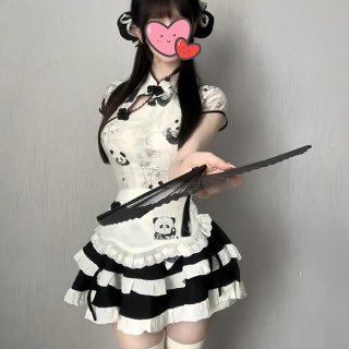 A woman wears a cute panda-themed domoira chinese-style maid outfit, featuring a black and white dress with ruffles and a fan...