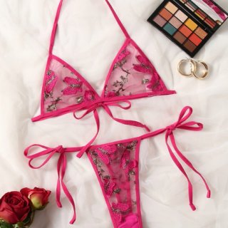 Pink lace bra and thong set with floral embroidery, elegant bridal or vacation lingerie for women.