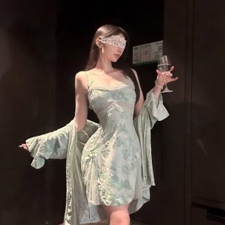 Woman wearing chaomu lace print lingerie set with sheer cami, matching briefs, and robe, holding wine glass.