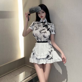 A stylish model showcases a black-and-white chinese new year-themed dress inspired by red silk, featuring lace detailing and ...