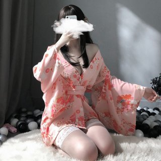 A person models a japanese-inspired sheer kimono-style sleepwear set, featuring floral patterns and lace details, perfect for...