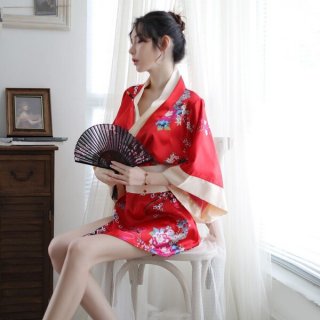 A woman sits gracefully holding a traditional japanese fan, wearing a vibrant red kimono adorned with floral patterns. the el...