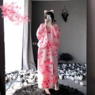A person wearing a pink floral japanese-style kimono, complete with cat ears, takes a mirror selfie. the outfit features long...
