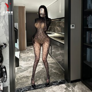 Woman in mirror wearing black sheer lace nightsigh nightseduce bodysuit with high neck and backless design.