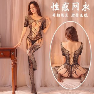 Model wearing qingyege plus size sheer mesh bodysuit with open crotch, attached stockings, and crisscross back detail.