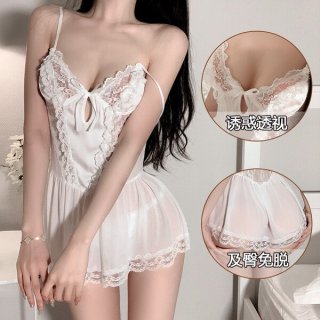Woman wearing a white lace sheer sleep dress with delicate straps and floral details, showcasing its sweet and alluring desig...