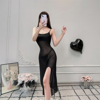 A woman poses in a sheer lace cami dress, featuring a side slit and romantic design, perfect for sleep or evening wear.