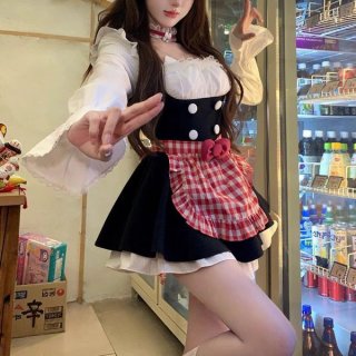 A woman poses wearing a sweet maid outfit featuring a white blouse with ruffled sleeves, black bodice with buttons, and a red...