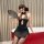 A woman poses elegantly in a black zhongqu sensual lace cheongsam lingerie, featuring sheer lace, ties, and cut-out details, ...