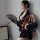 A woman poses elegantly in a muxue 1009 japanese-style erotic lingerie set, featuring a black kimono with floral patterns and...