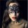 Woman wearing black lace cut-out blindfold mask from nightclub queen lingerie set, perfect for parties and role play.