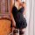Woman wearing qqny sensual lingerie sleepwear set with lace bralette and matching robe, featuring elegant black design and ga...