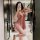 Woman in pink lace-trimmed slip dress posing in bathroom mirror, showcasing plus size sexy sleepwear for women - busty allure...