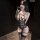 Woman wearing black lace bodysuit with sheer panels, removable cups, and matching thigh-high stockings — pure & seductive lin...
