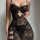 Woman wearing black lace sheer sleepwear set with adjustable straps, featuring erotic lingerie nightgown design in -style.