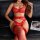 Woman in red lace bodysuit and fishnet stockings, elegant erotic lingerie set for intimate nights.