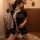 Vintage-inspired black qipao with high slit and short hem, featuring delicate lace trim and traditional buttons, perfect for ...
